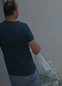 walking light-shirt grey-shorts man crop 2